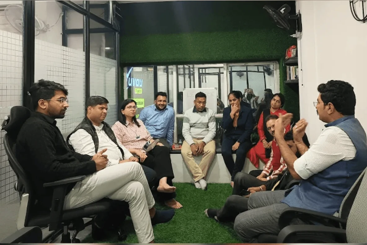 Yuvau team working together in an office meeting